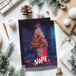Funny Christmas card with a decorated tree in a trash can and the text “Ho Ho Nope.” Perfect sarcastic Christmas card for people who don’t do holiday cheer.
